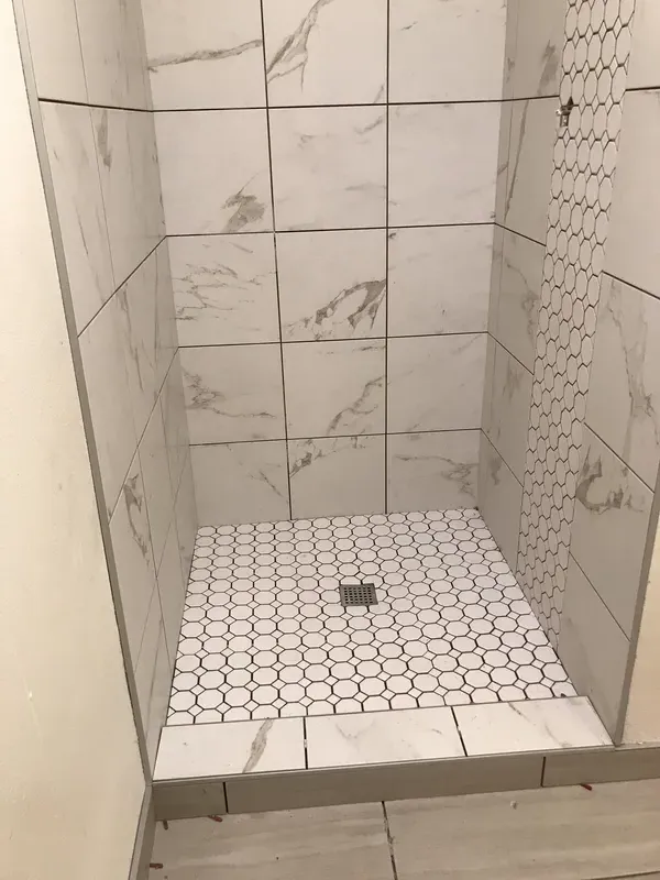 White tile and for a walk in shower