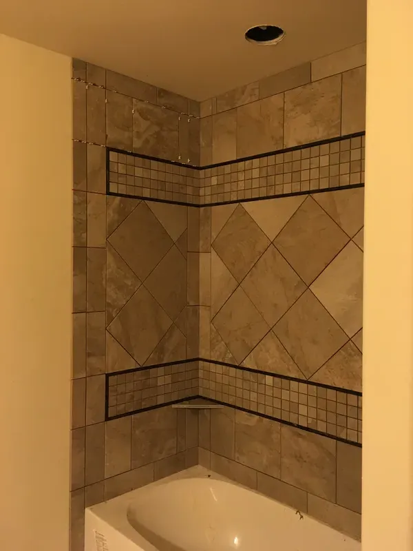 Another angle of the unique tile pattern in the walk in shower