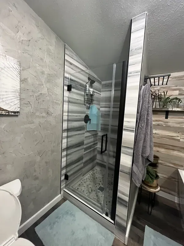 Striped pattern tile job for a walk in shower