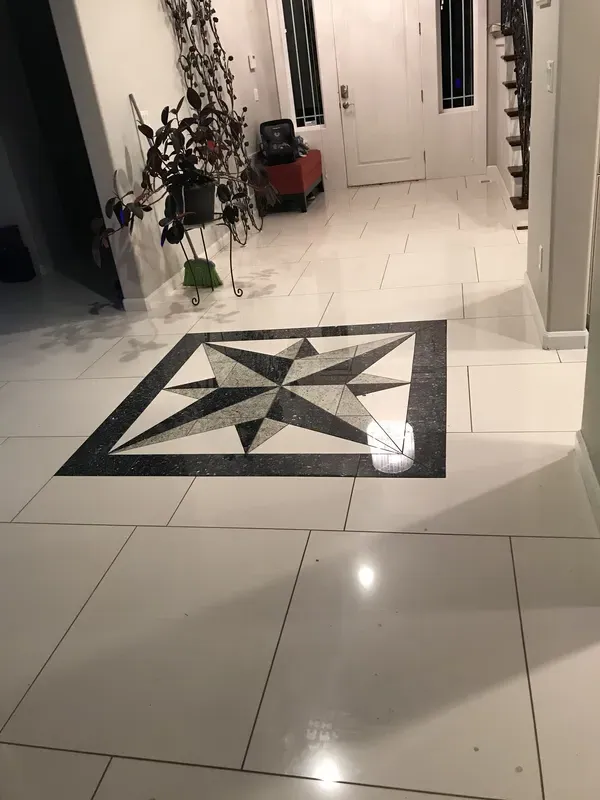 Intricate stone and tile start pattern in flooring
