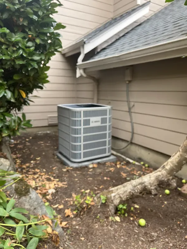 Large air conditioning unit installed at back of house