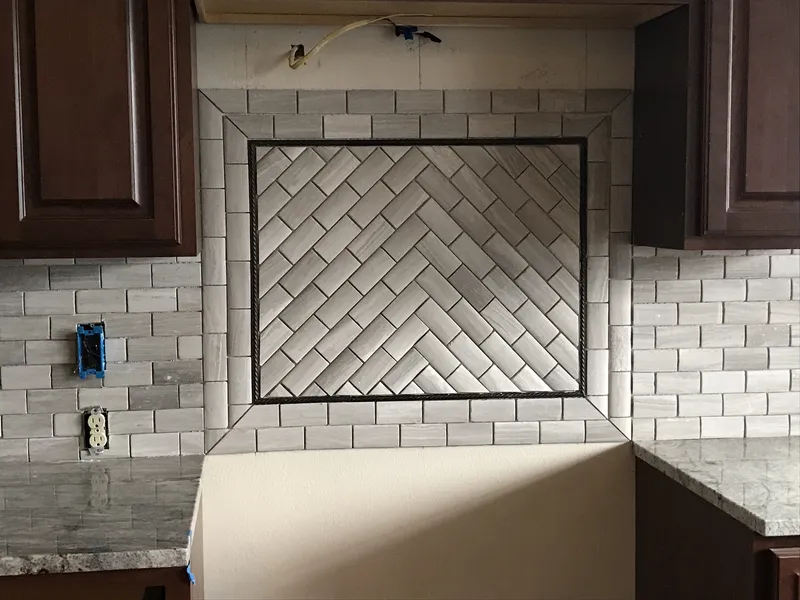 Angled unique tile pattern on kitchen oven backsplash